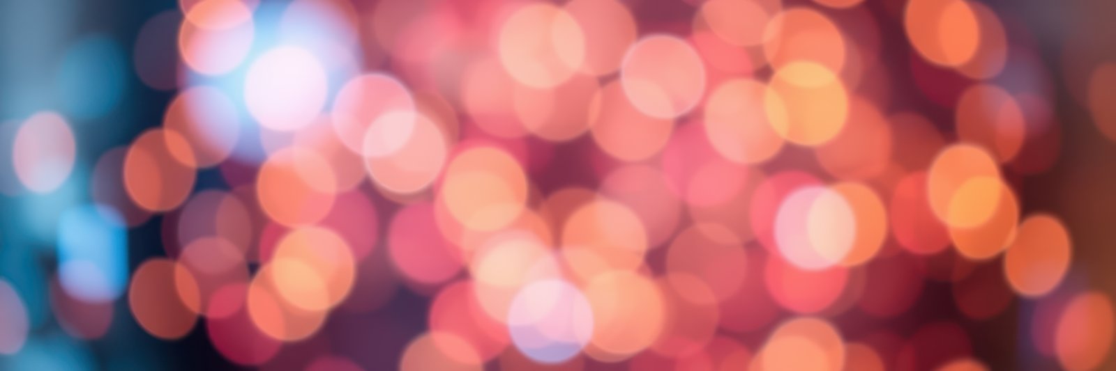 Soft, glowing bokeh lights create a warm and inviting atmosphere during evening celebration indoors